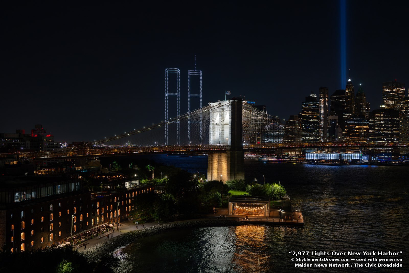 A wide view of New York Harbor on the night of the display