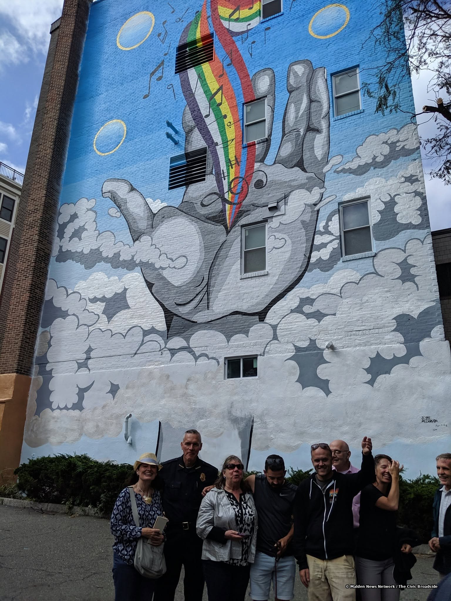 The art team with a local official