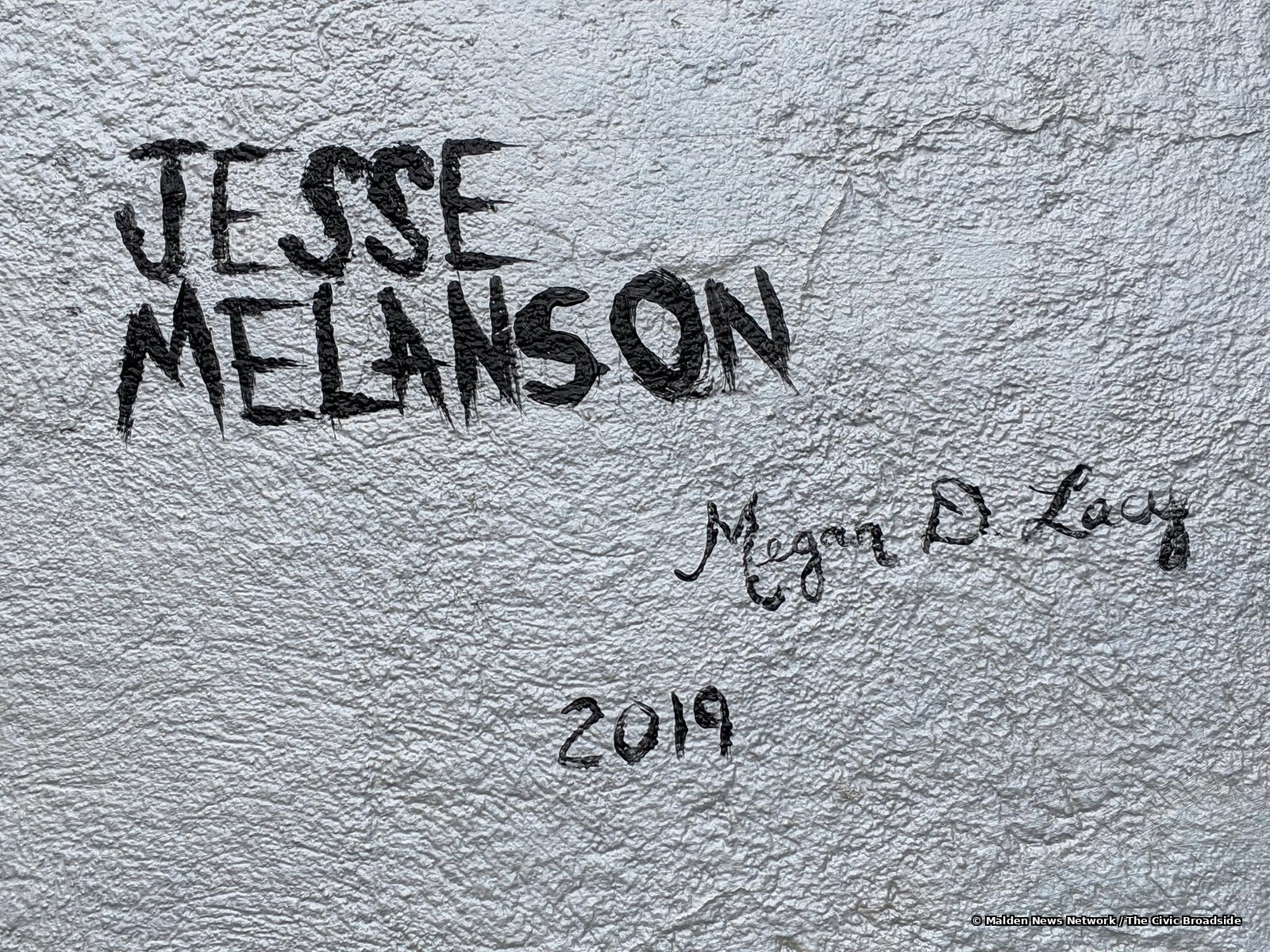 Jesse Melanson and Megan Lacy's signatures on the mural, dated 2019