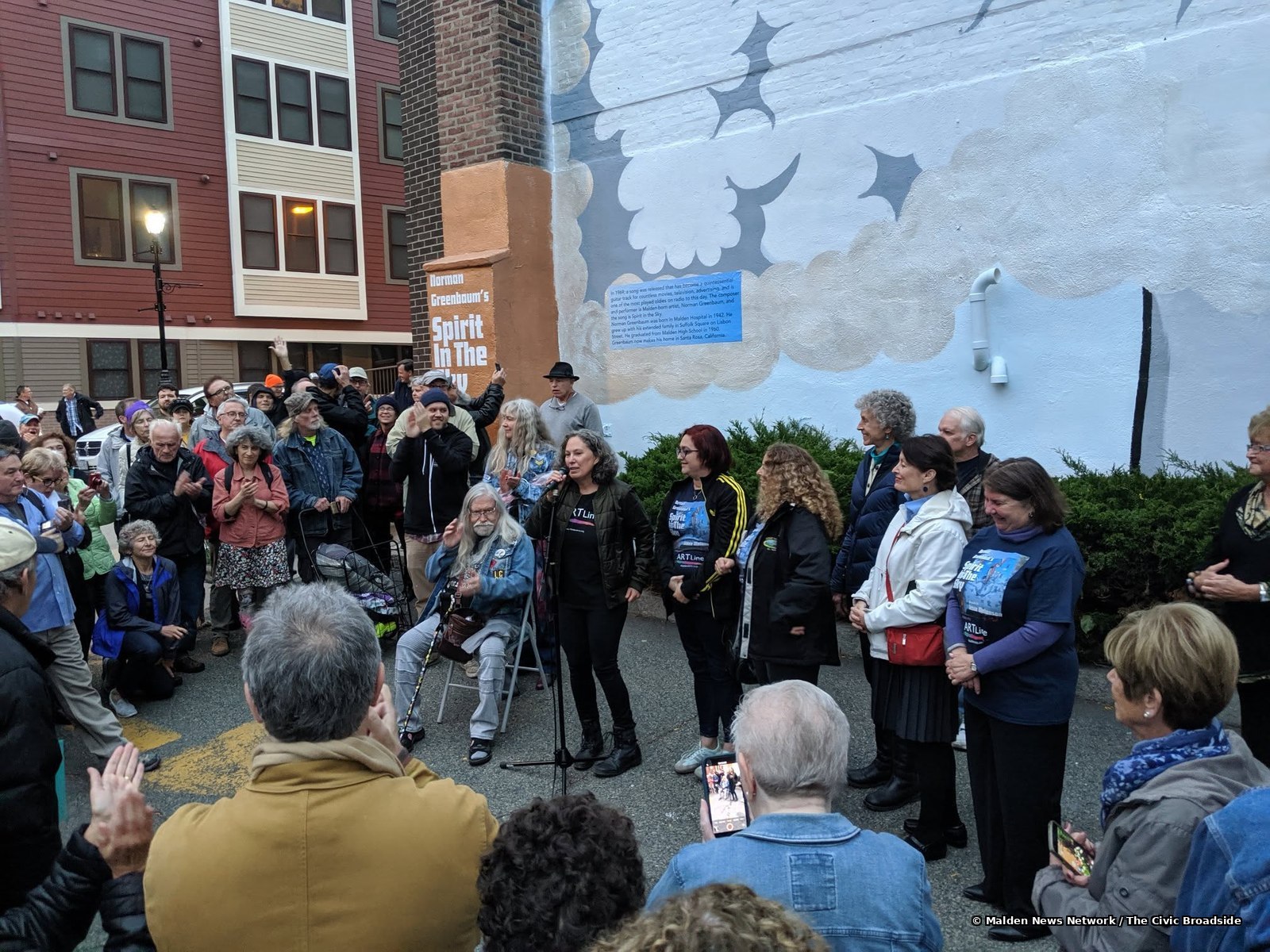 Crowd gathering for the Malden Arts event